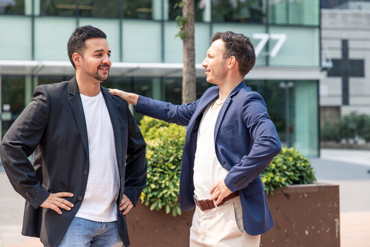 Technology startup founders discussing business partnership outdoors