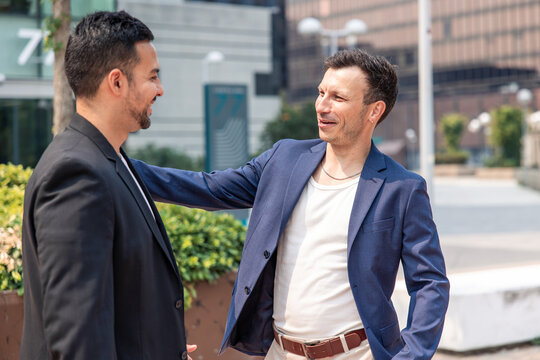 Two startup founders meeting greeting friendly partnership