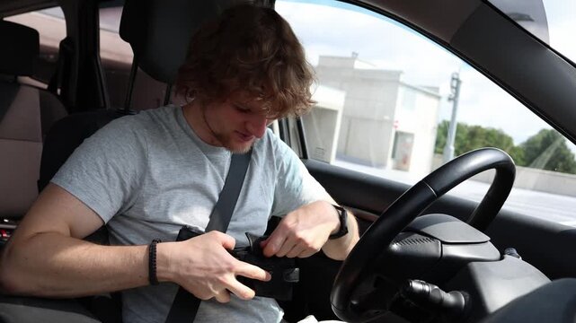 Driver holds an empty wallet near his face inside a parked car feeling stressed and disappointed as costly maintenance and repair bills leave him with no money left today