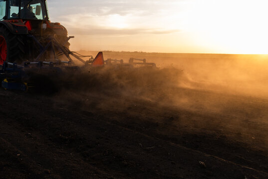 Tractor preparing the land for a new crop planting