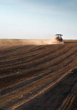 Farmer on tractor Preparing the land for a new crop planting