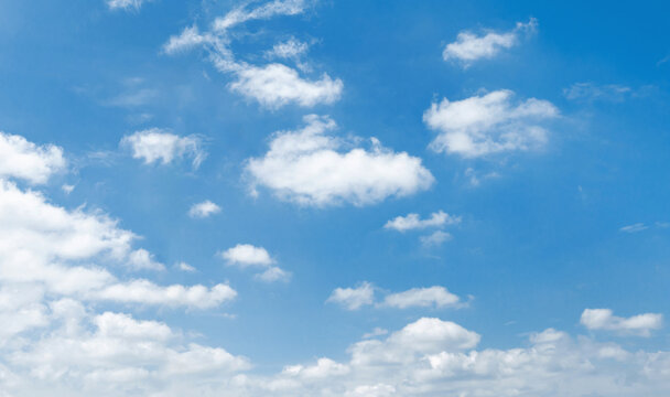 Bright blue sky with fluffy white clouds