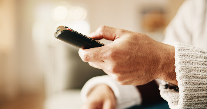 Watch, movie and hand with remote control, home and channel surfing with technology or subscription. Streaming, space and person with controller for entertainment, browse and film selection in house
