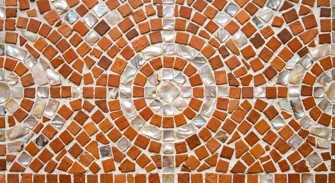 Terracotta and mother of pearl circular mosaic wall pattern