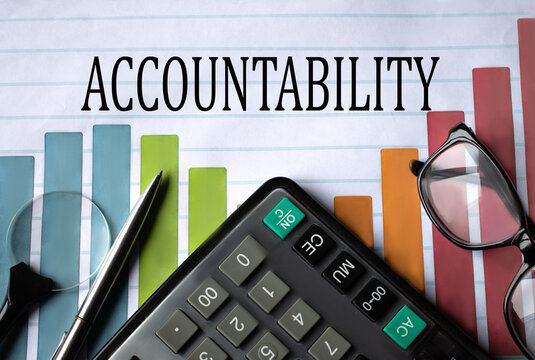 ACCOUNTABILITY - word on a color chart with a calculator, magnifying glass and glasses