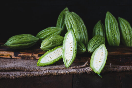 Fresh bitter melons on the dark background