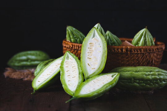 Fresh bitter melons on the dark background