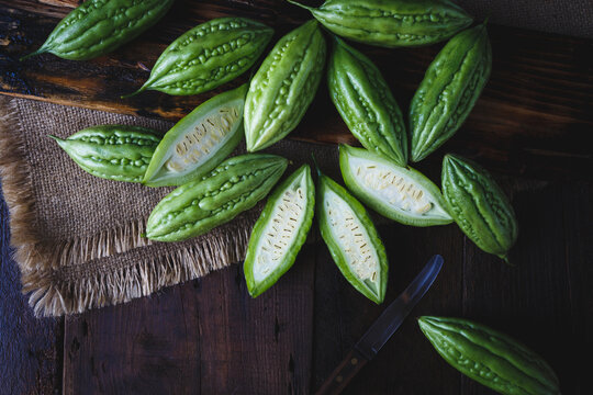 Fresh bitter melons on the dark background