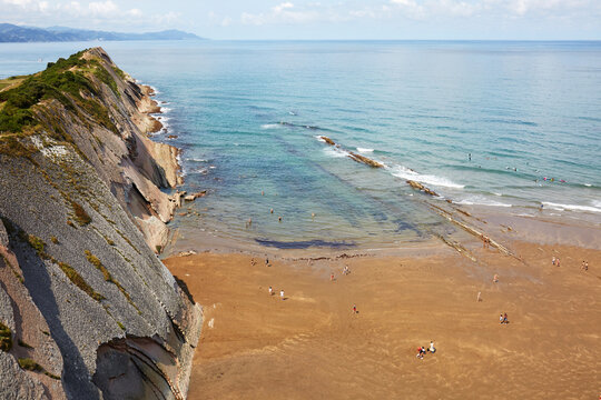 High angle panoramic view of steep flysch rock cliffs and Itzurun beach in Zumaia Basque Country Spain