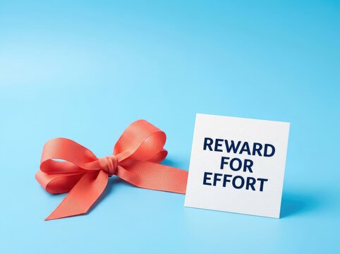 Coral ribbon bow beside reward card suitable for business motivation content symbolizing appreciation effort recognition and success