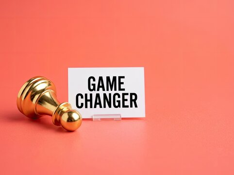 Gold chess pawn beside a game changer note perfect for strategic business content symbolizing innovation transformation and disruption