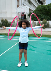 African American kid girl playing hula hoop © chachamp