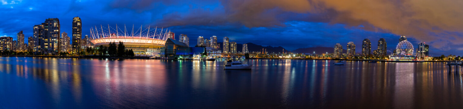 Canada, Skyline of Vancouver at night with BC Place Stadium and TELUS World of Science