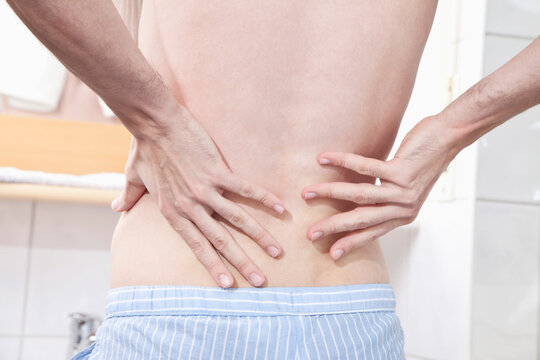 Young man having back pain