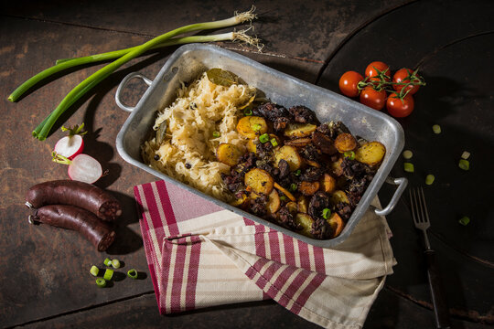Blunzngroestl, fried blood sausage with fried potatoes and sauerkraut