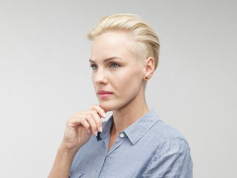 Young woman looking away, close up