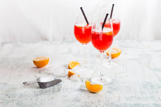 Aperol spritz, bitter liqueur, prosecco wine, sparkling mineral water and orange slice