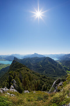 Austria, Upper Austria, Salzburg State, Salzkammergut, View to Lake Mondsee left, Drachenwand, Schafberg and Lake Wolfgangsee against the sun