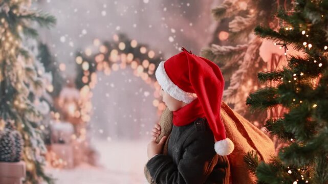 Happy child on Christmas, enjoying some quality time, opening presents, kids and adults with pet dog on Christmas eve in decorated home