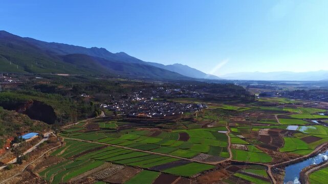 Aerial View of Rural Farmland Village in Mountain Valley