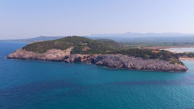 Aerial Pullback From Rocky Headland to Ionian Coast at Voidokilia, Greece