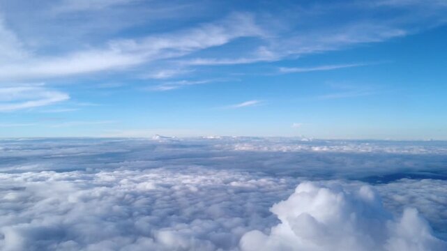 Aerial View Above Endless White Cloud Layer Under Blue Sky