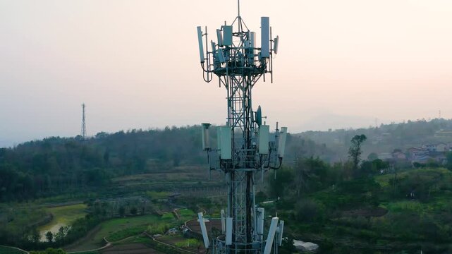 Cellular Tower and Antennas in Rural Landscape at Sunset