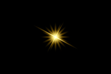 Fototapeta premium Golden yellow single starburst lens flare with bright center rays on black background