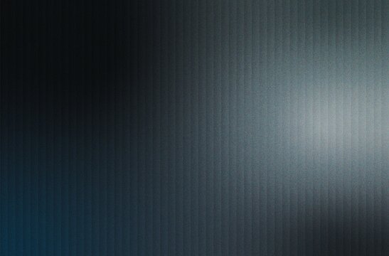 Soft gray glow on dark black grainy striped background