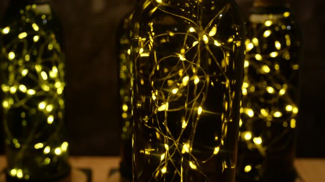 Recycled Bottle Lamps With LED Lights and One Spinning Lamp Close Up