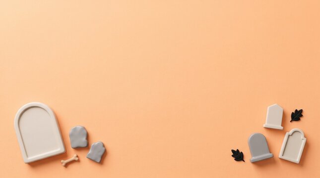Miniature gray tombstones arranged in corners on light orange background for Halloween cemetery theme banner