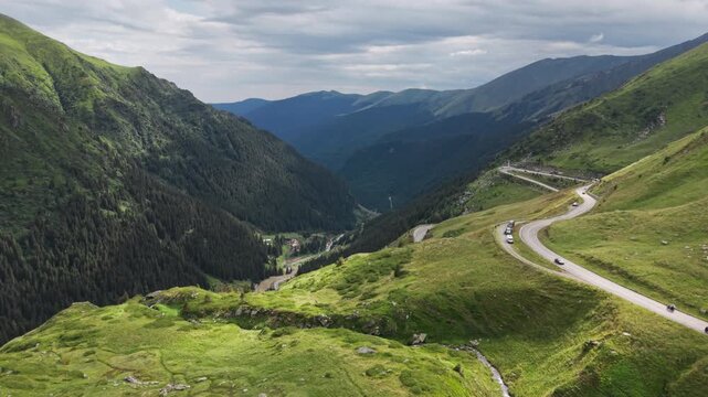 Sunlit Hairpins Across Carpathian Green Slopes