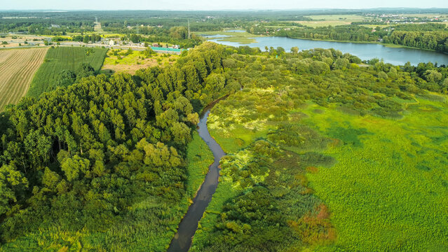 Serene countryside with river and open meadow