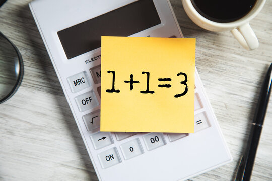 1+1=3 text on white paper