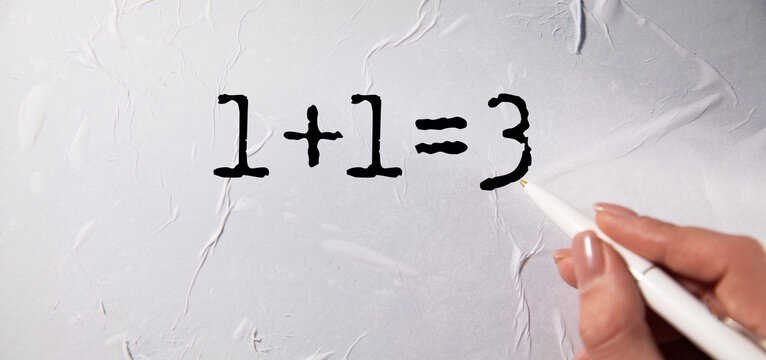 1+1=3 text on white paper