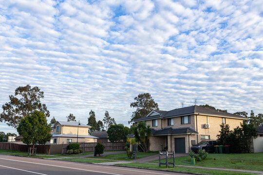 Quiet morning streetscape scene with dramatic Altocumulus clouds