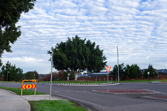 Quiet morning streetscape scene with dramatic Altocumulus clouds