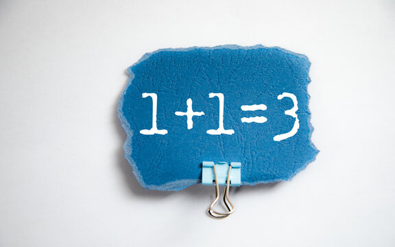 1+1=3 text on white paper