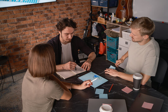 Team collaboration on a creative project in a modern workspace