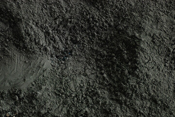 Naklejka premium Full frame background texture of fine black organic peat powder used for agricultural soil fertility