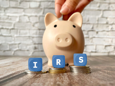 IRS Tax Planning and Savings Concept with Piggy Bank and Coins