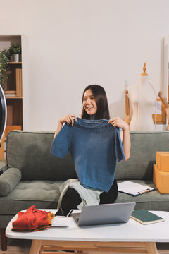 Woman recording live stream preparing packages for online selling