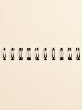 Blank open spiral notebook mockup with empty white page and ring binder for design backdrop