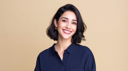 Fototapeta premium Smiling Qatari businesswoman posing against a beige background with copy space