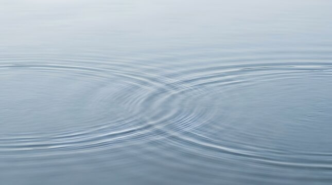 Gentle water ripples intersecting on a calm blue surface