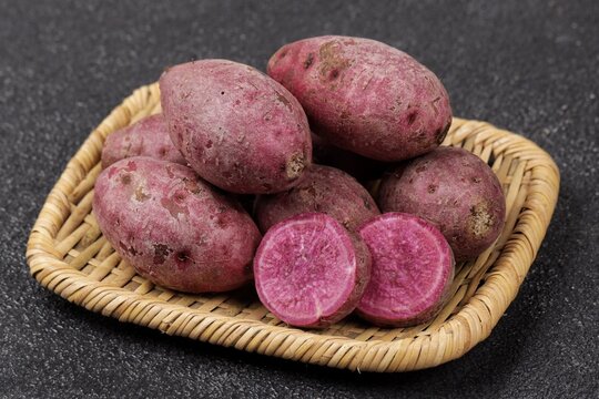  purple sweet potato or ubi ungu with naturally vibrant purple flesh and a mildly sweet flavor.