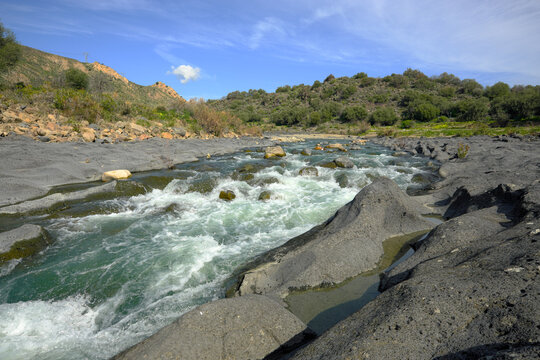 rapids of Simeto River and erosion of volcanic basalt in Sicily, Italy