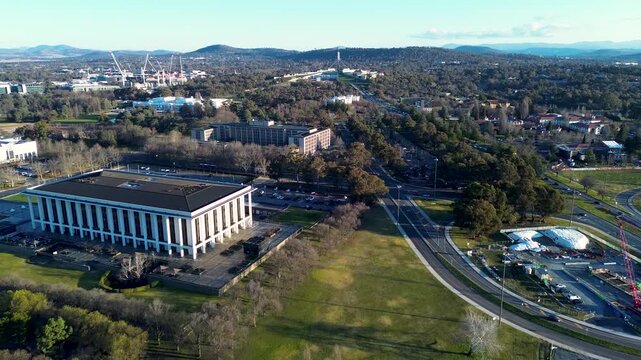 Drone aerial landscape of the National Library of Australia landmark building surrounded by roads and the Parliamentary Triangle precinct in Parkes Lake Burley Griffin Canberra ACT tourism travel