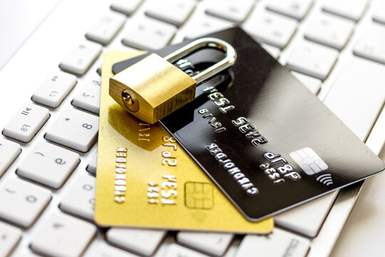 Credit cards on the keyboard with lock close up