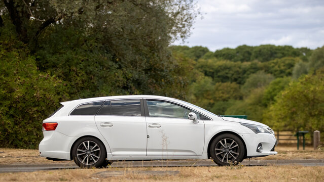 Milton Keynes,UK - Aug 22nd 2026: 2014 white Toyota Aventis estate car driving on a British road